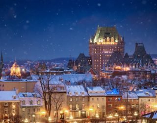 Elevated view of the Quebec City skyline at night on a snowy Winter night, looking towards the old city and the Chateau Frontenac